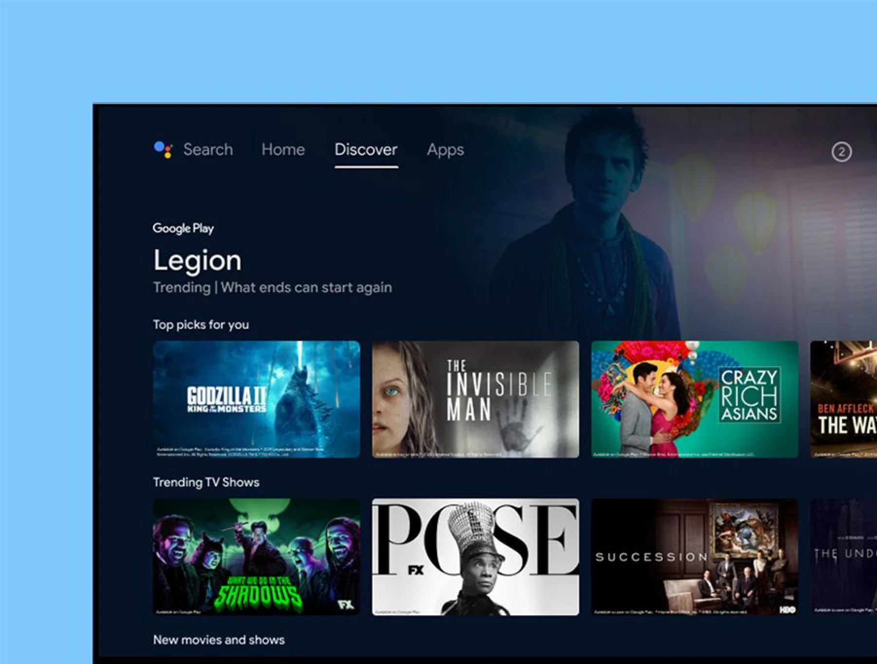 Close-up of an Android TV home screen on a television: navigation, a featured title and rows of film and TV show tiles